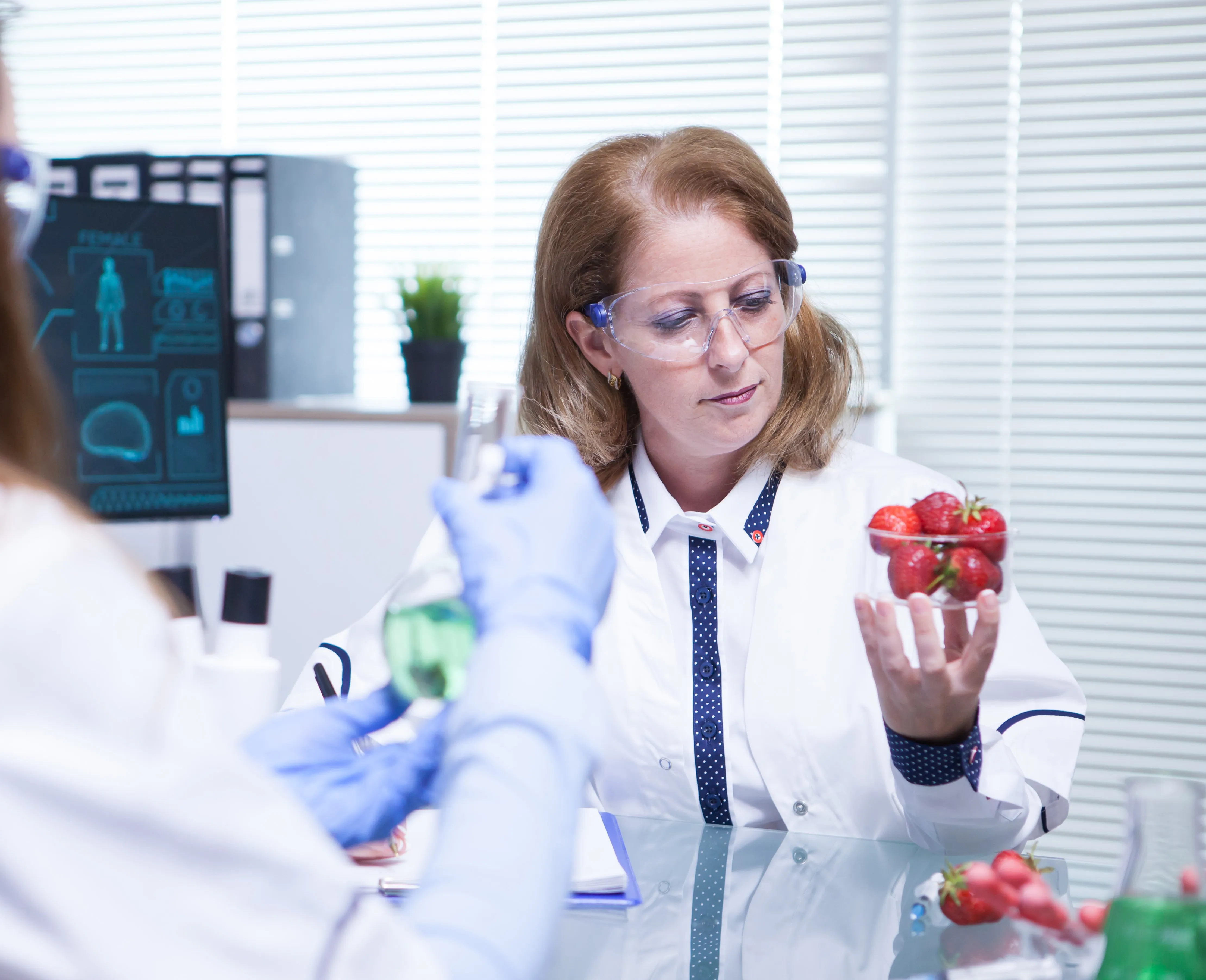 lady scientist testing strawberries